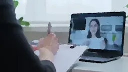 Cropped picture of a therapist giving an online session